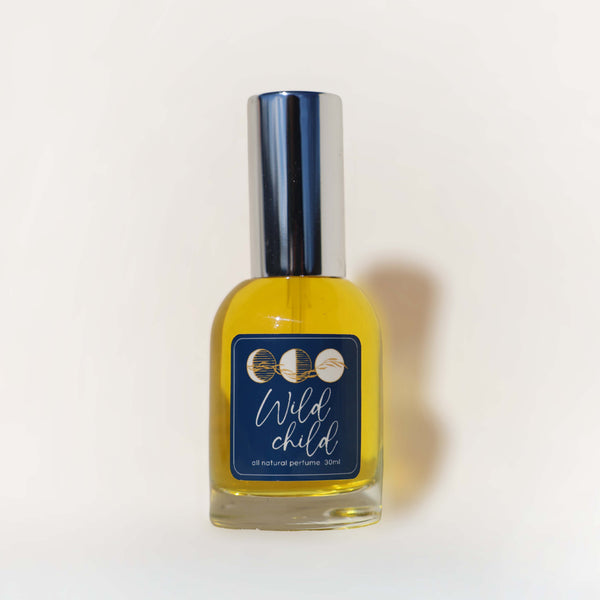 Perfume bottle labeled 'Wild Child' on a white background