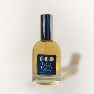 Bottle of Rock Creek perfume on a white background