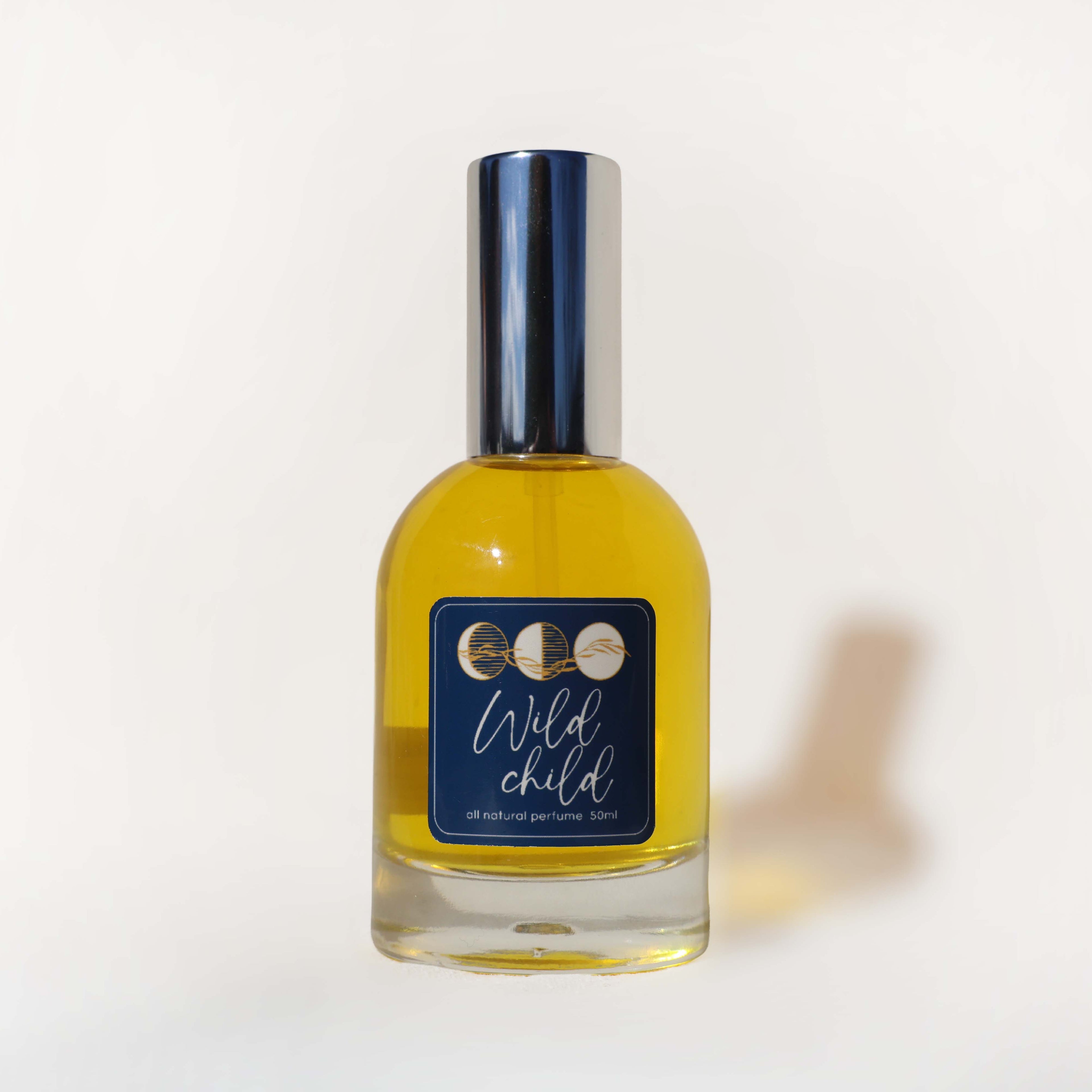 Bottle of 'Wild Child' perfume with a blue label on a white background