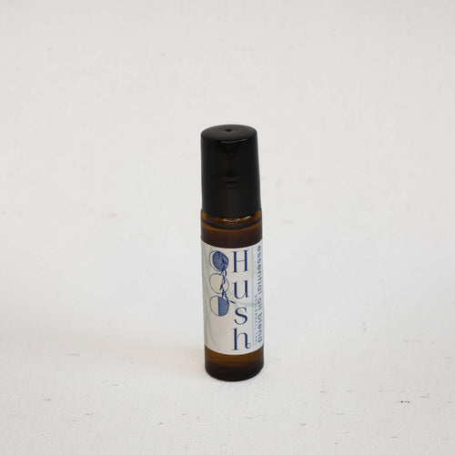 Small rollerball bottle with a label on a white background
